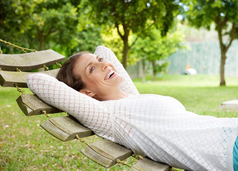 Happy woman relaxing outside