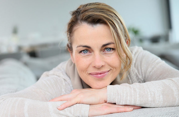 Middle age woman relaxing on a couch