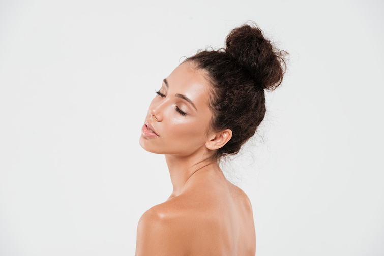 Beautiful woman with glowing skin posing for the camera