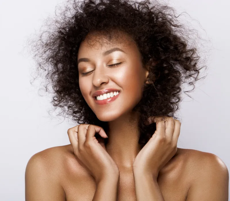 Beautiful brown woman with glowing skin