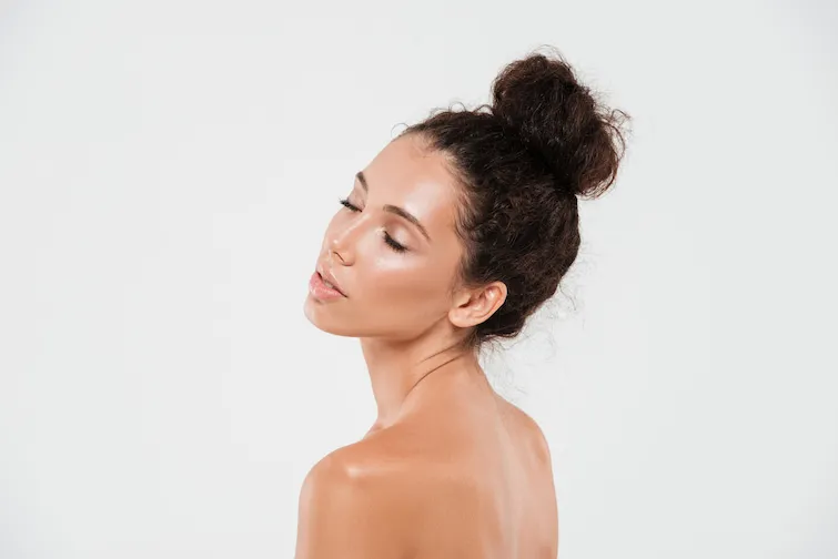 Beautiful woman with glowing skin posing for the camera
