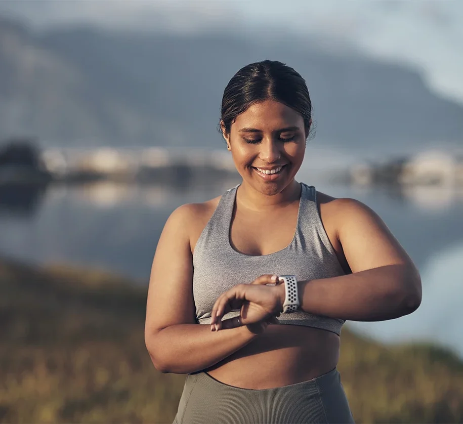 athletic plus size woman jogging outdoors