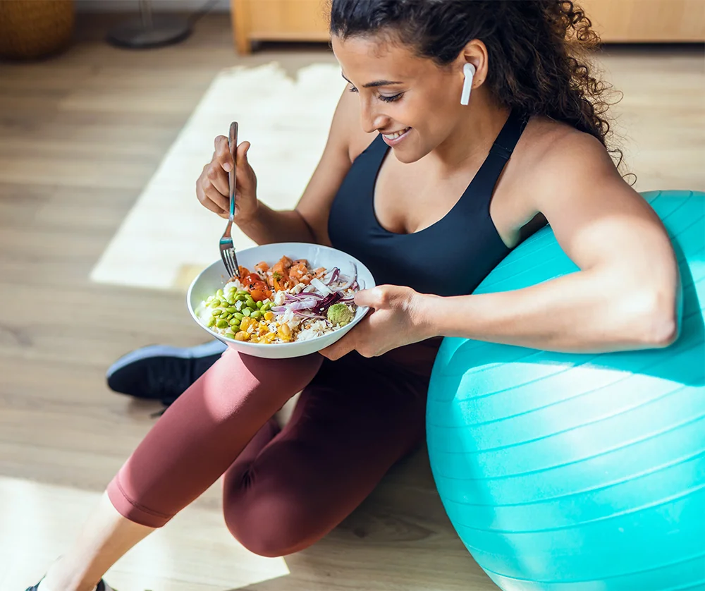 woman eating healthy after exercising