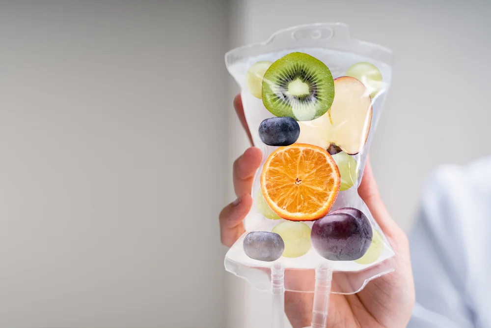 woman holding an IV bag