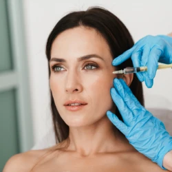 middle age woman being injected with botox