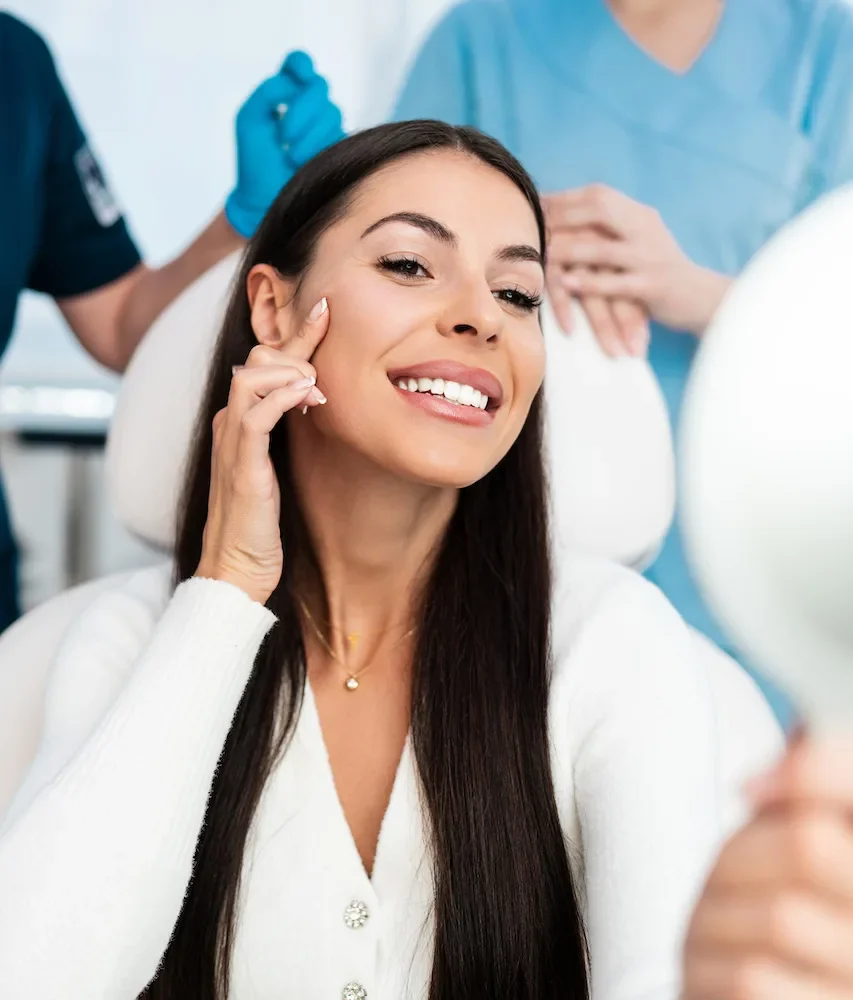 patient looking at her results after juvederm filler