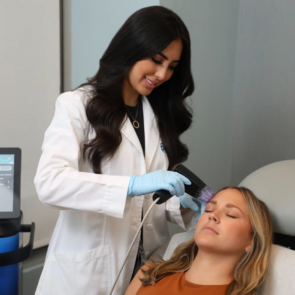 DBMS provider, Lauren, treating client with Morpheus skin tightening