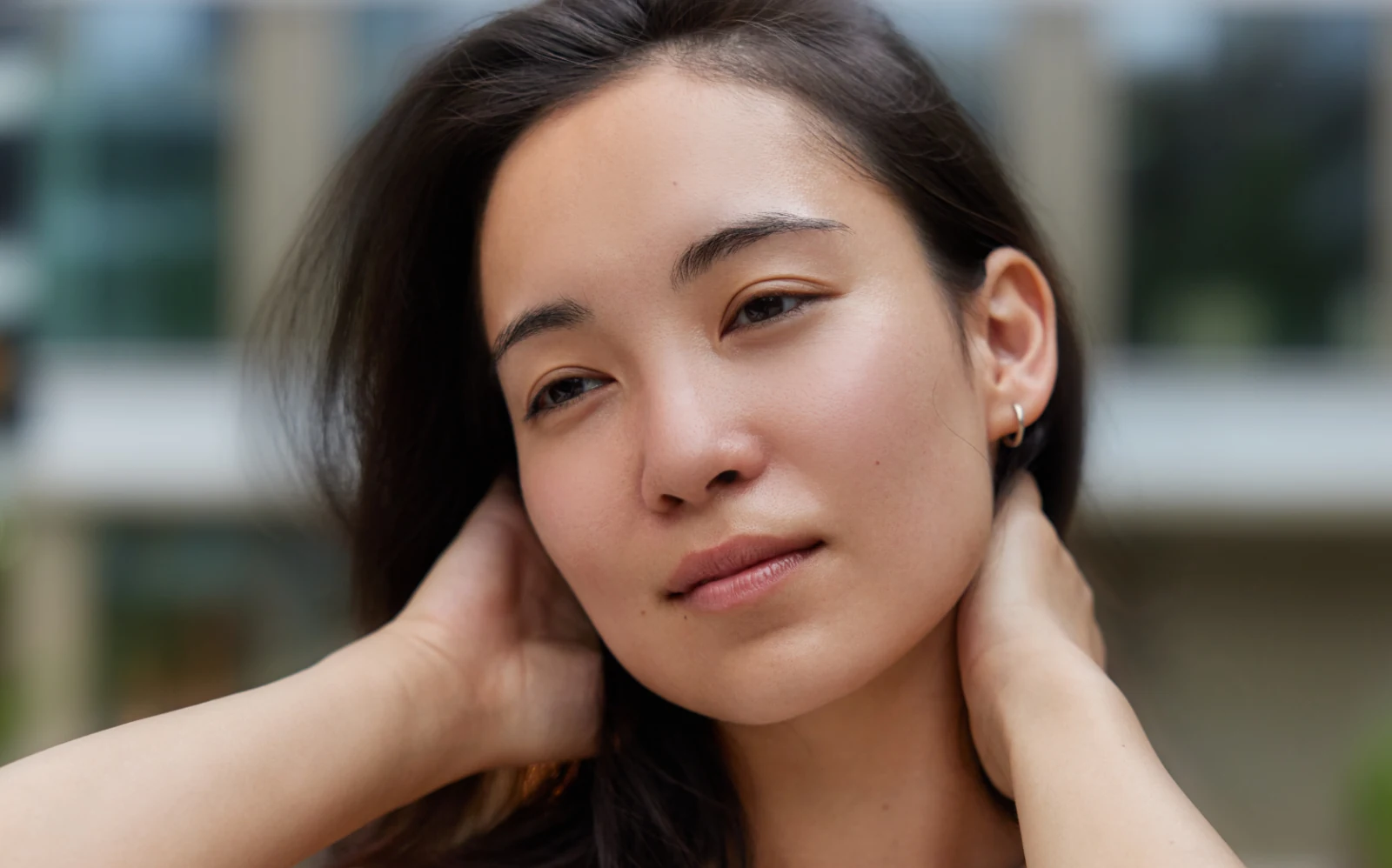gorgeous woman in the city with flawless skin