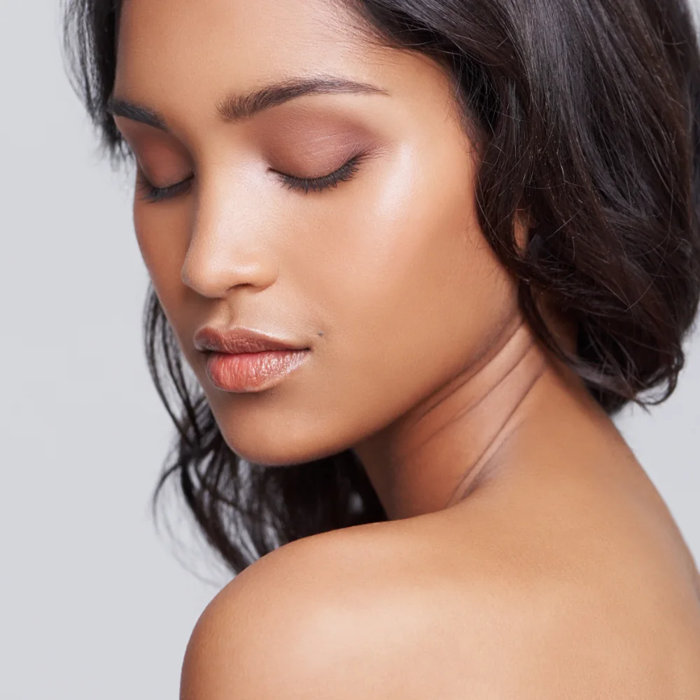 close-up of woman with beautiful glowing skin