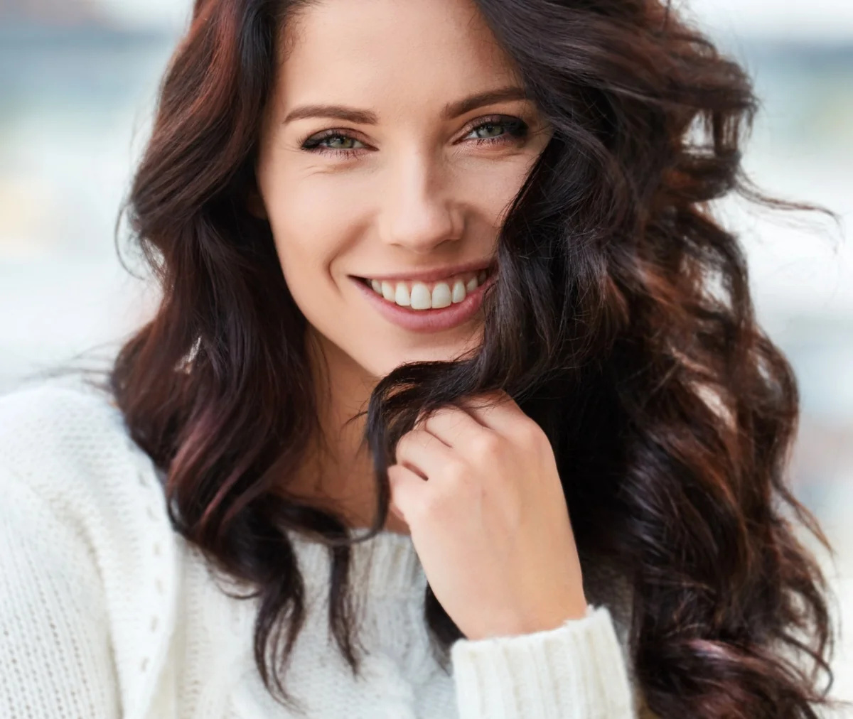 happy woman with youthful, glowing skin