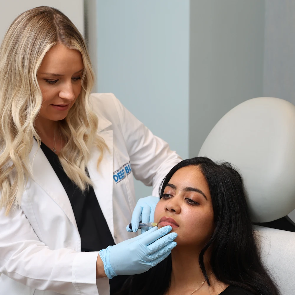 DBMS provider, Olga, giving lip filler to a patient