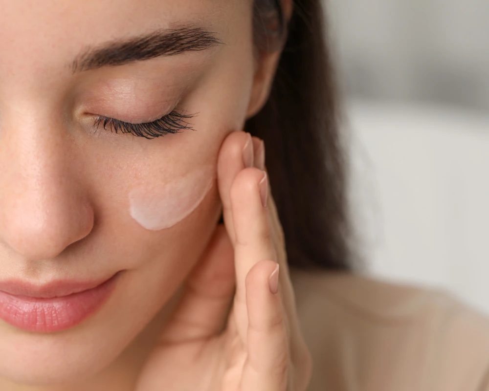 woman applying skincare product