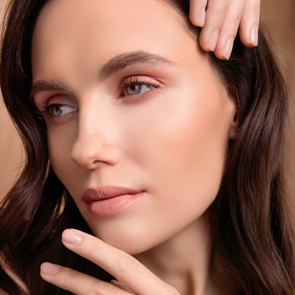 woman with smooth skin on face after facial treatment